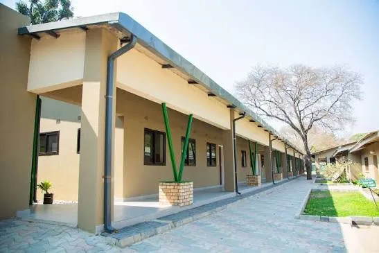 A block of classrooms with a covered walkway on the Lusaka Oaktree School campus